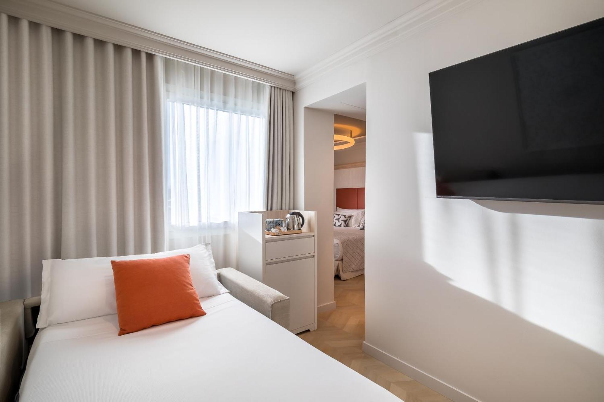 Triple Room (2 Adults + 1 Child )