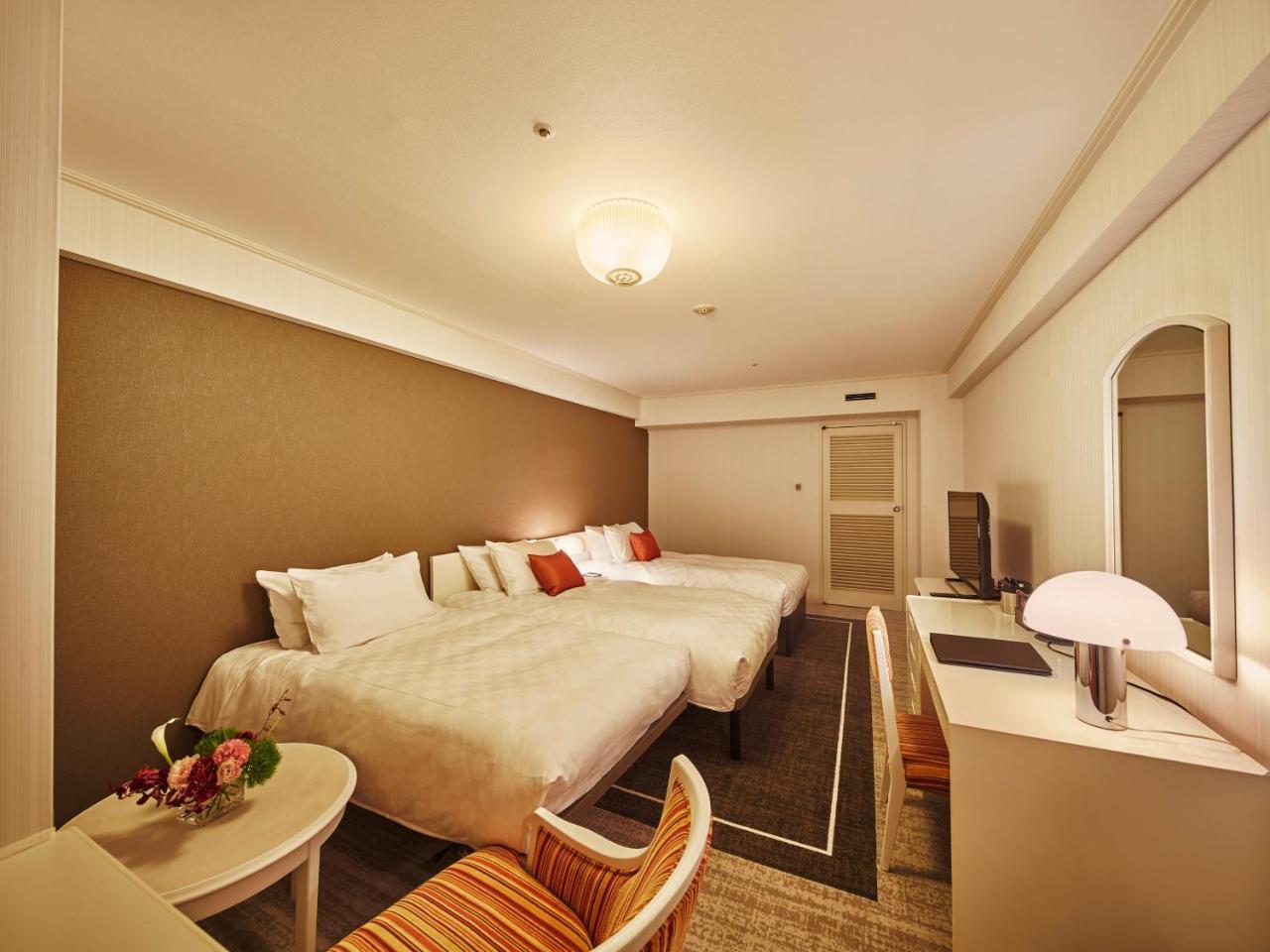 Quarto Deluxe com 2 Camas de Solteiro e Cama Extra - Não-Fumantes