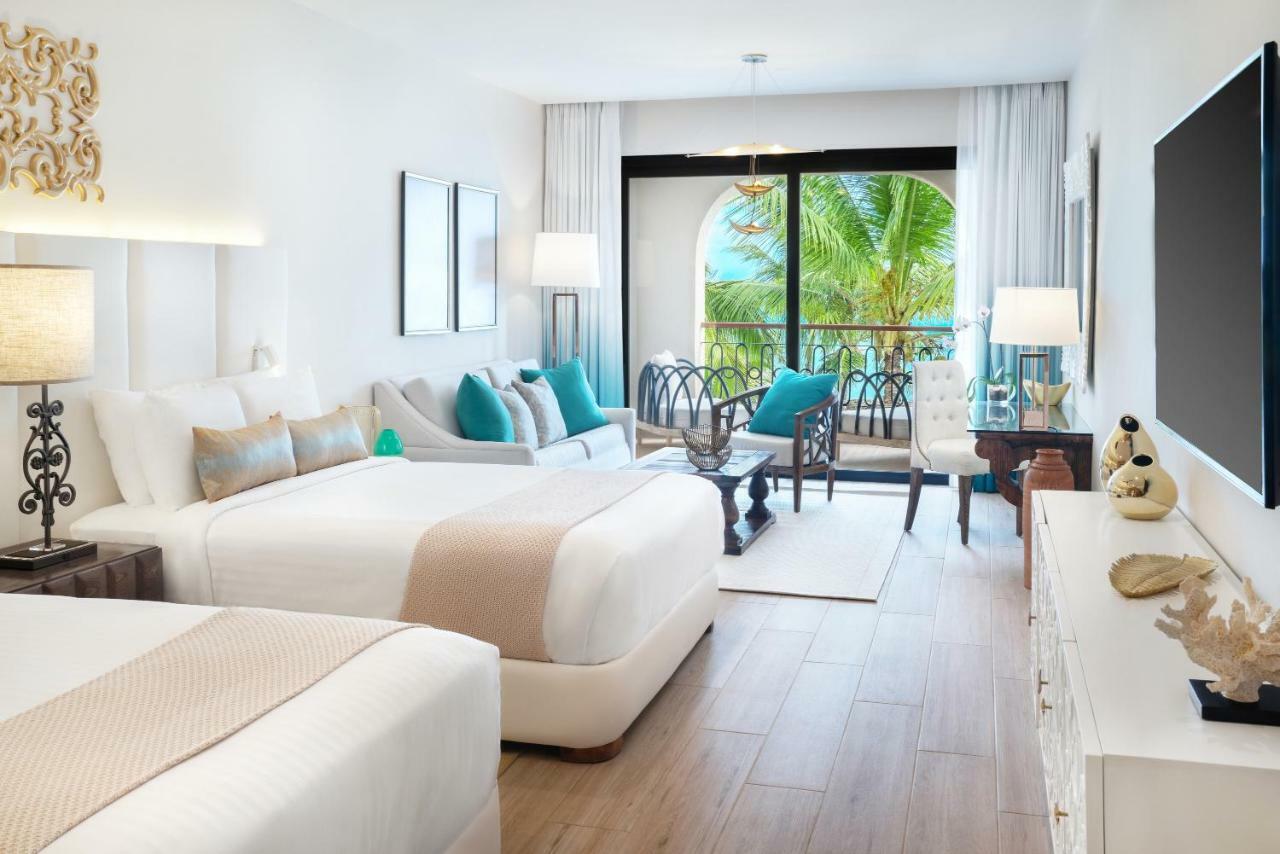 Suite Junior de lujo con 2 camas grandes, balcón y vistas al jardín